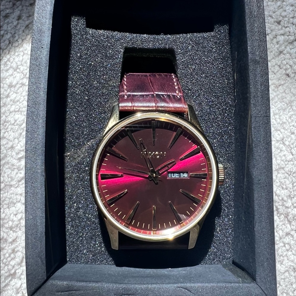 Nixon Red and gold faced leather watch